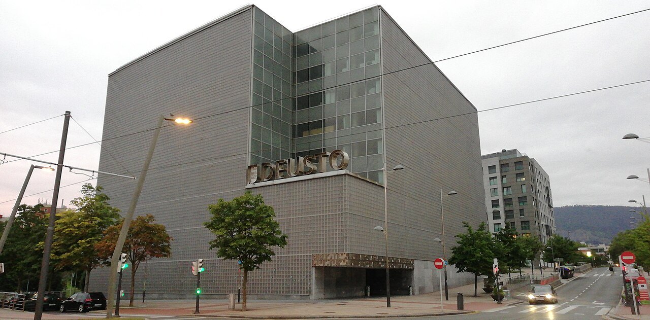 The University of Deusto library, a gray cube of stone and glass on the left bank