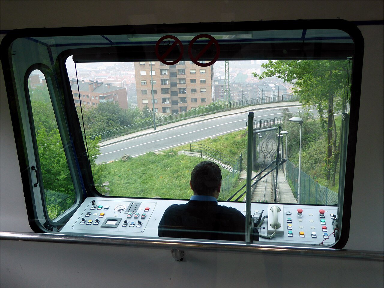 From the driver's cab of the Artxanda funicular, the track dropping toward the city