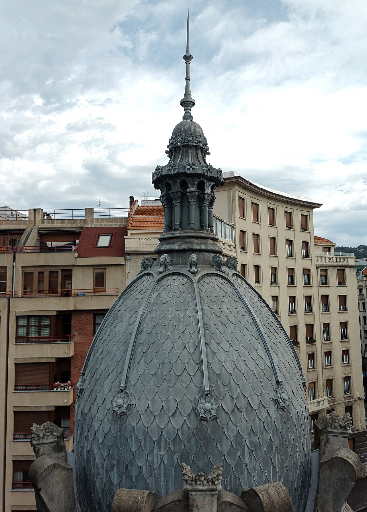 One of the scaled corner domes of Azkuna Zentroa against the sky