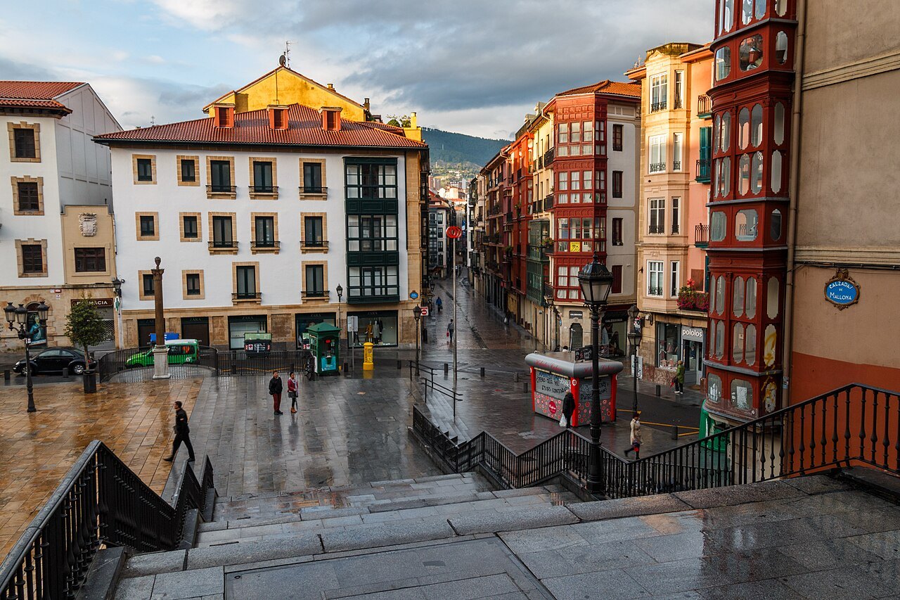 The foot of the Mallona steps opening onto a square in the old town, after rain
