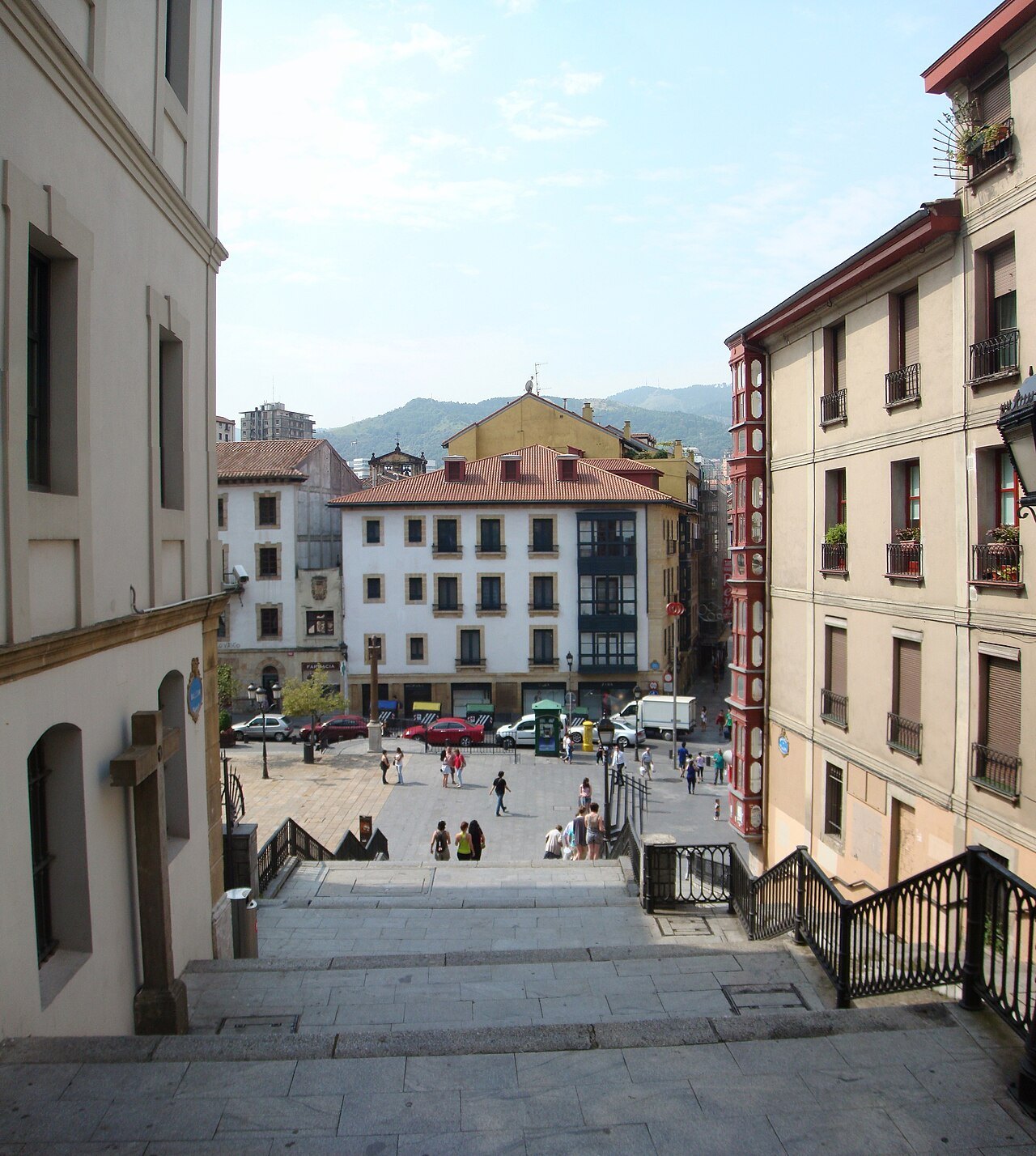 Steps leading down into the old town, the hills beyond the roofs