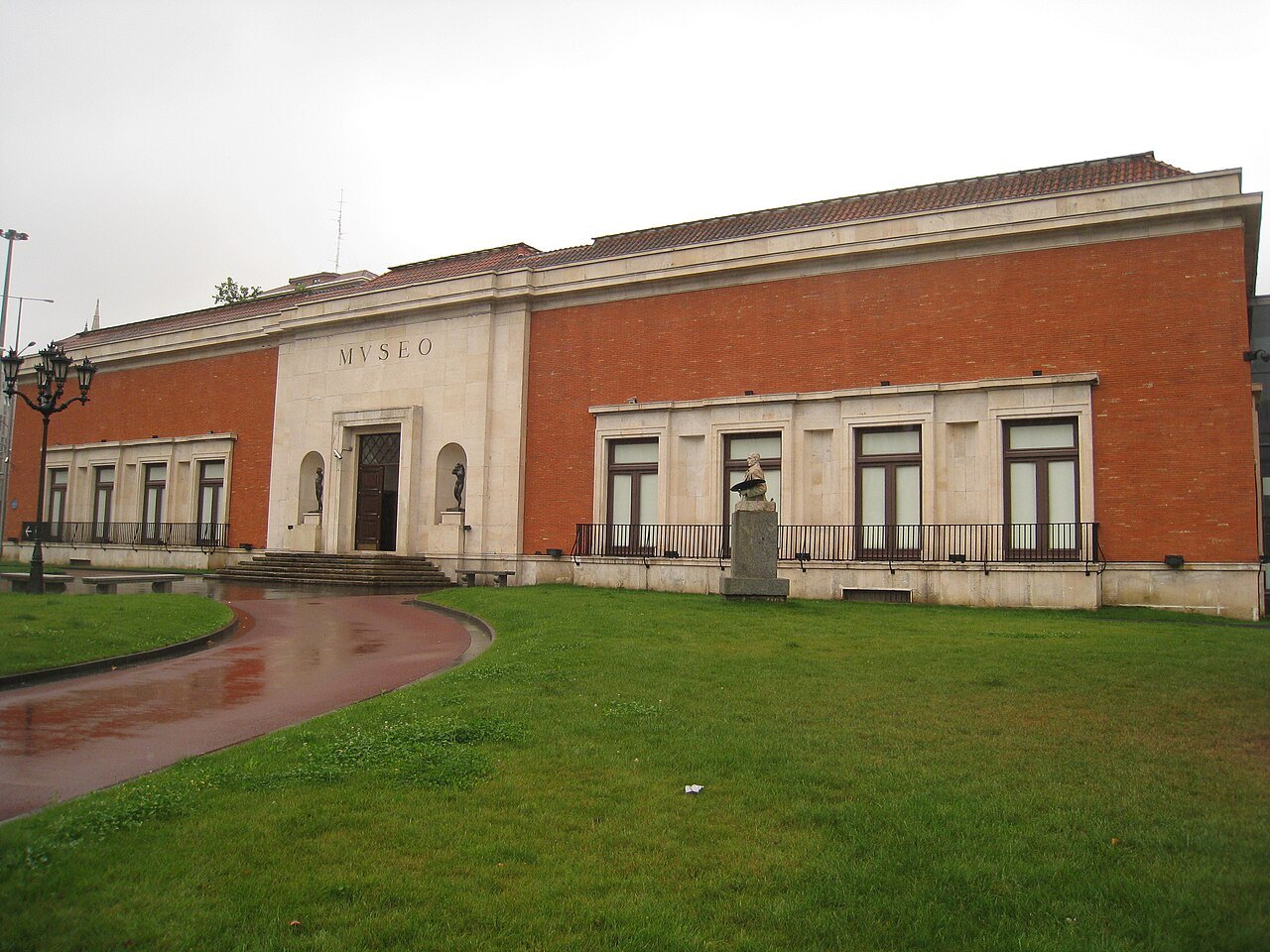 The brick and stone building of the Fine Arts Museum above its lawns