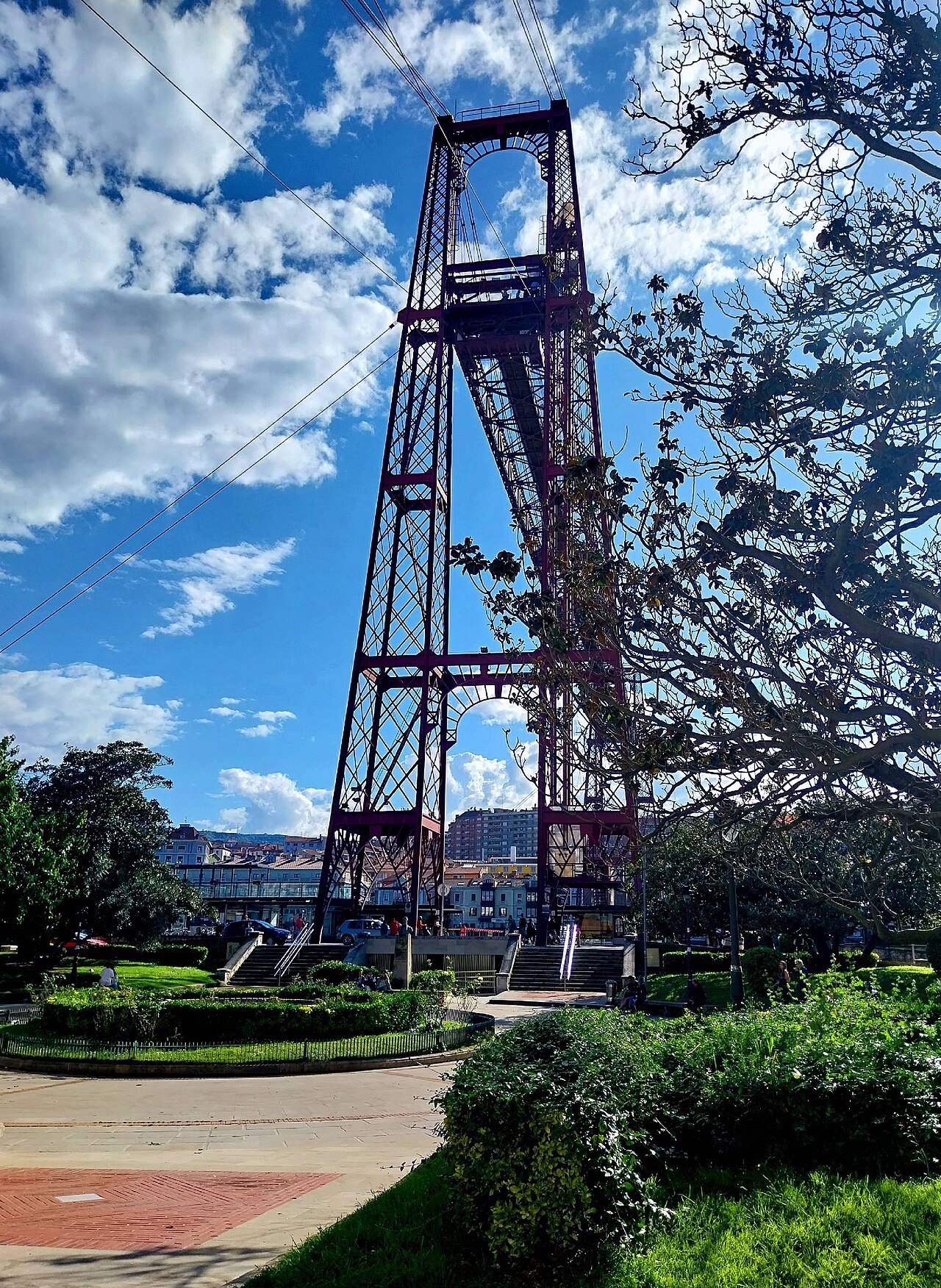 Looking up a tower of the Bizkaia Bridge from the gardens at Las Arenas