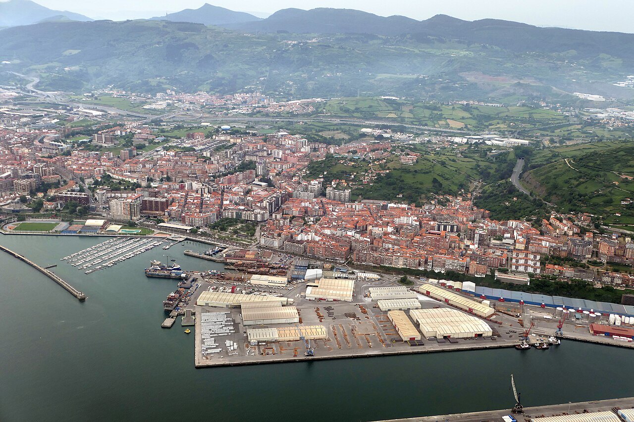 Santurtzi and its port from the air, the mountains behind
