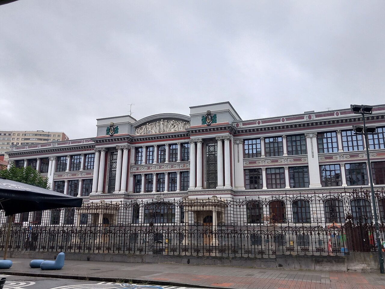 The arcaded front of a school building in Indautxu