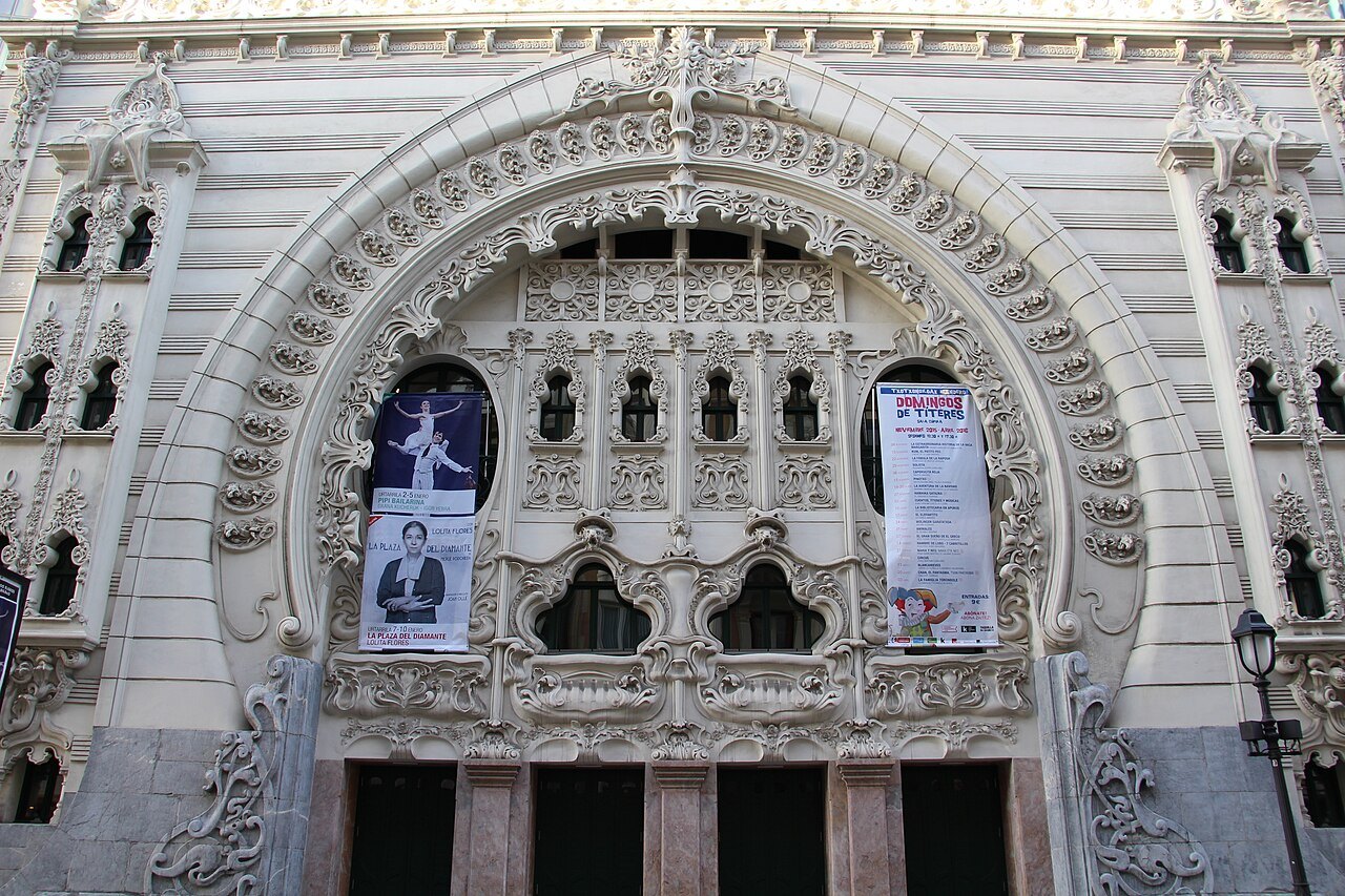 The ornate Moorish-style arch of the Teatro Campos Elíseos, posters at the door