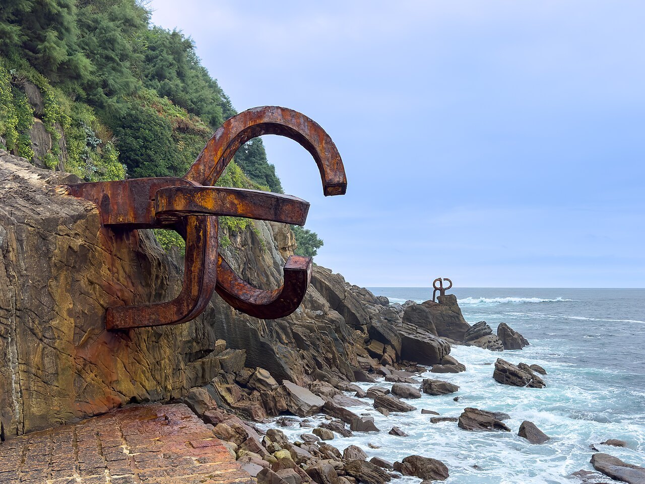 Eduardo Chillida's rusted steel Comb of the Wind on the rocks at the end of San Sebastián's bay