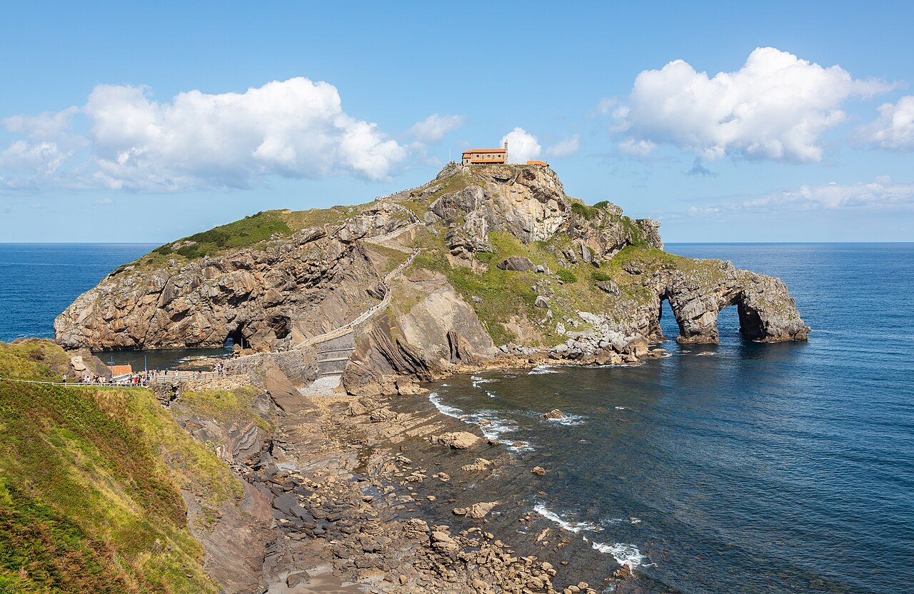 The islet of Gaztelugatxe and its natural arch, the path winding up to the hermitage