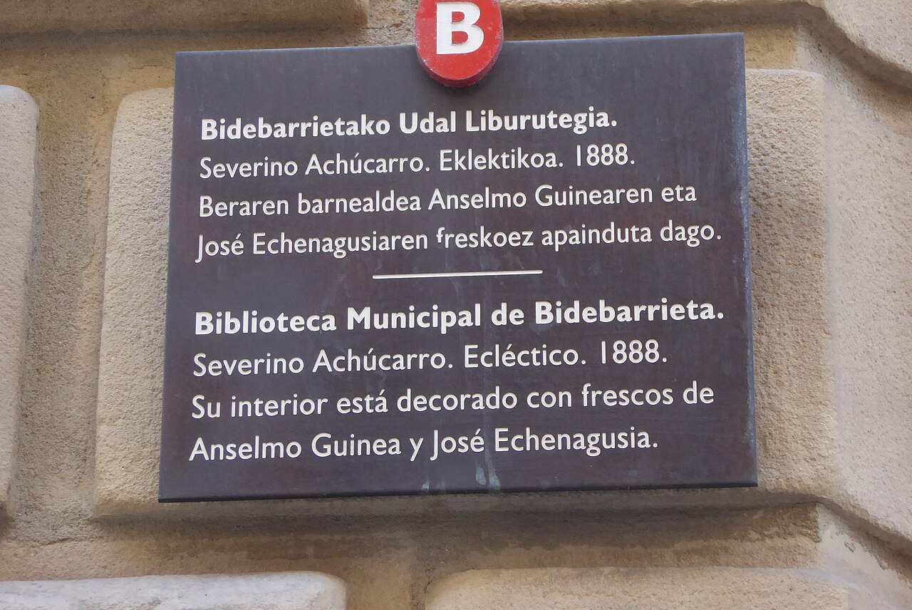 A bilingual plaque on the Bidebarrieta library, in Basque above and Spanish below
