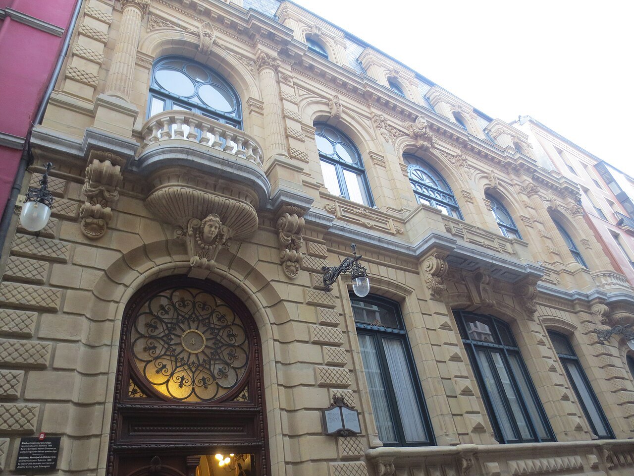 The ornate stone front of the Bidebarrieta library in the old town