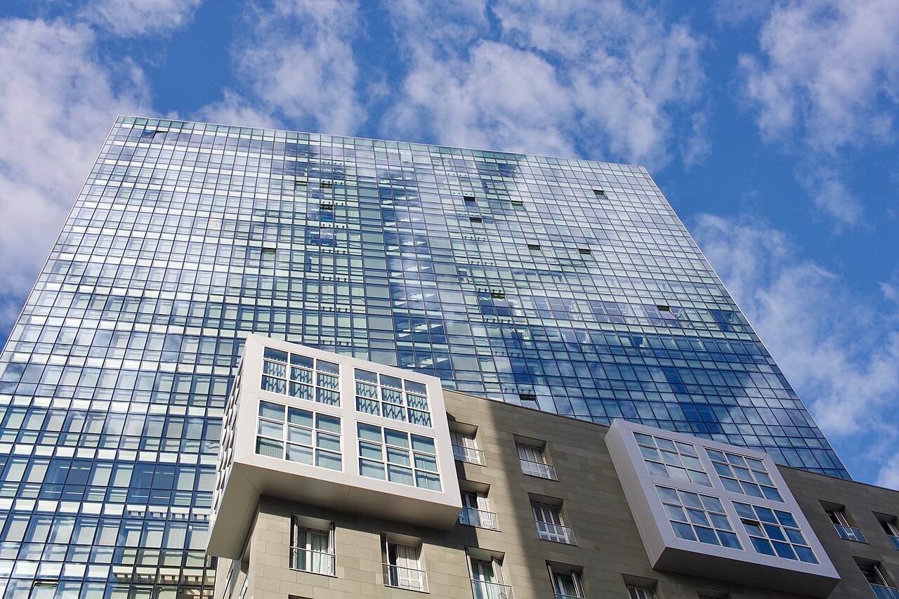 The mirrored glass of an Isozaki Atea tower against the sky