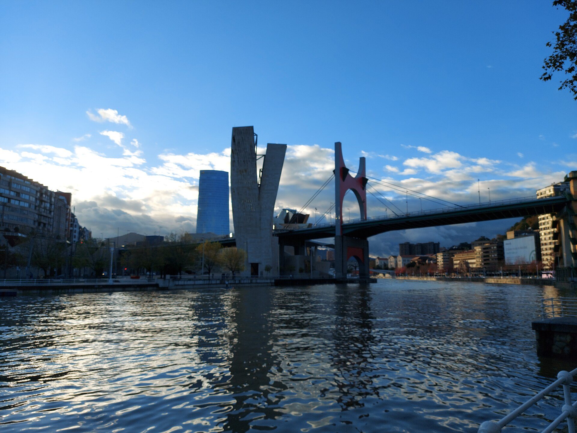 La Salve bridge and the Guggenheim tower seen across rippling water