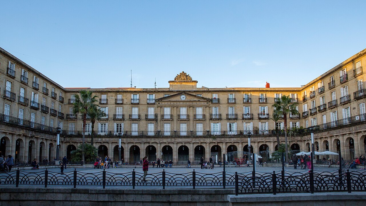 The whole length of the Plaza Nueva's arcades in late afternoon sun