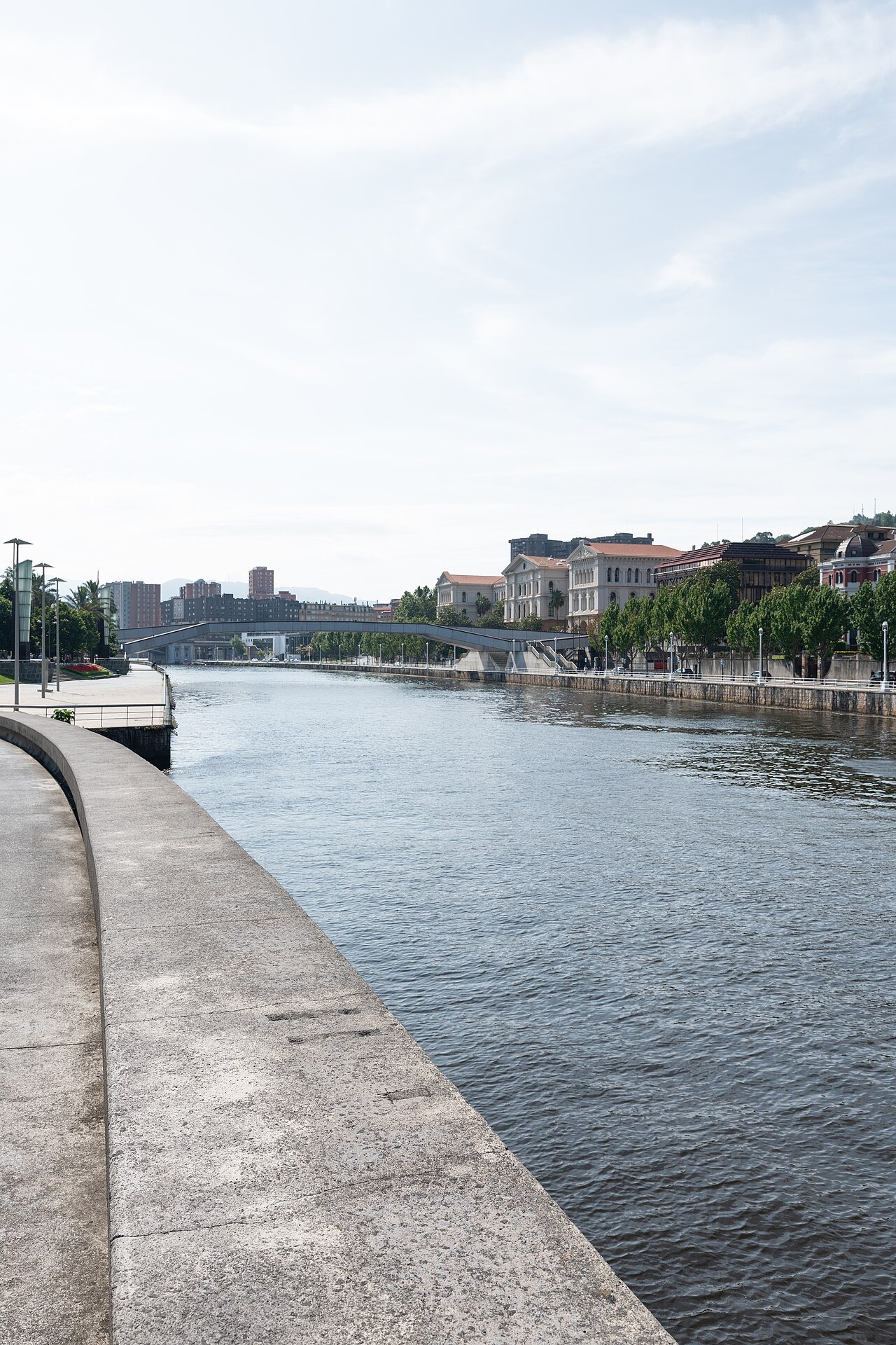 The river walk downstream toward the Pedro Arrupe footbridge