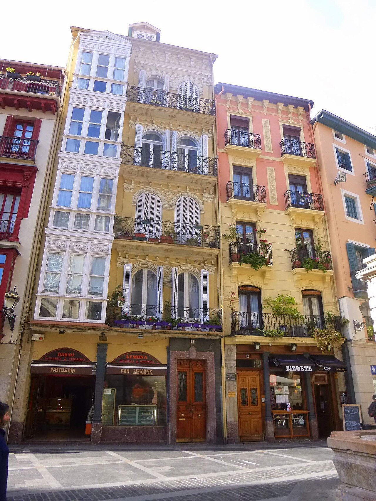 Tall houses with glazed galleries at a corner of the old town