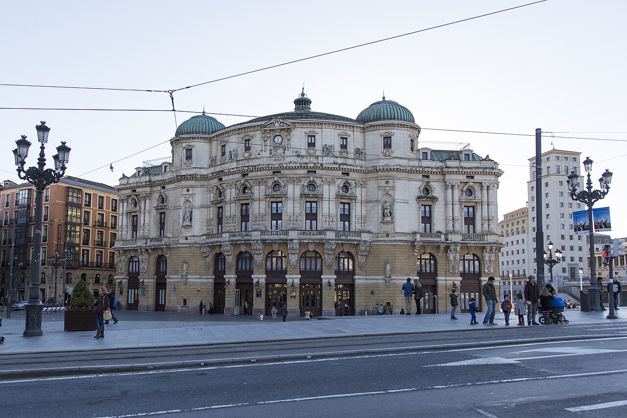 The Teatro Arriaga at the end of its square, tram wires overhead