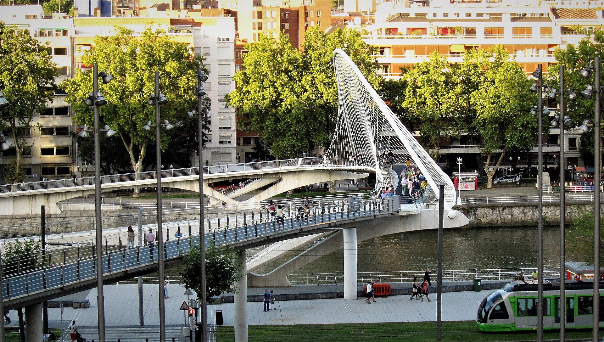 Zubizuri curving across the river, its white arch and cables