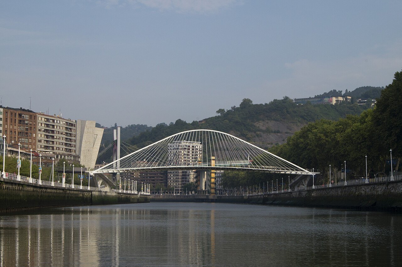 Zubizuri seen low from the river, wooded hills behind