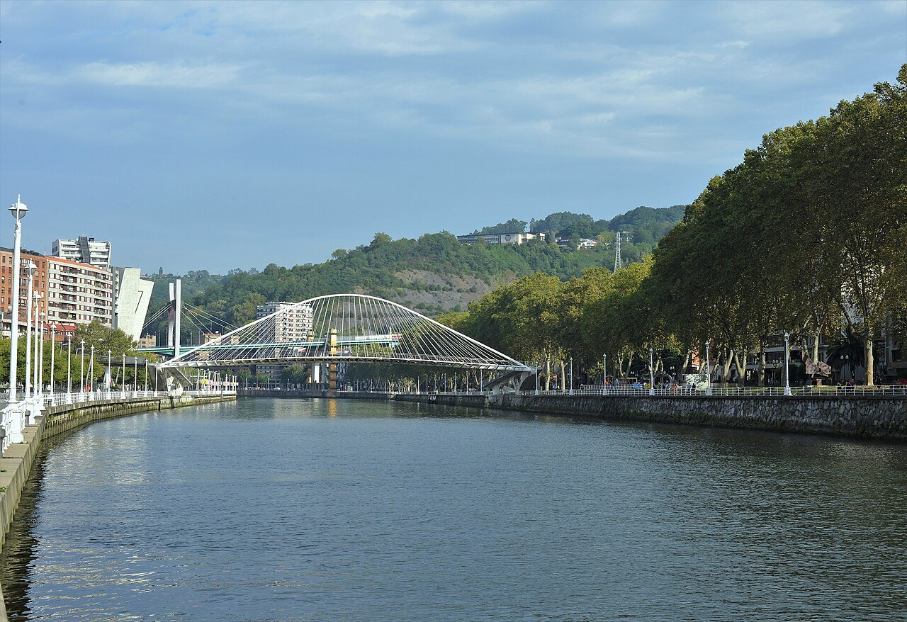 Zubizuri's white arch across the Ría, seen down the right bank